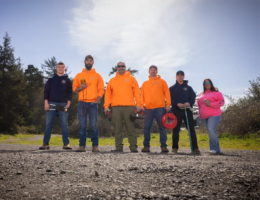 A photo of the Travis Electric staff posed together outdoors